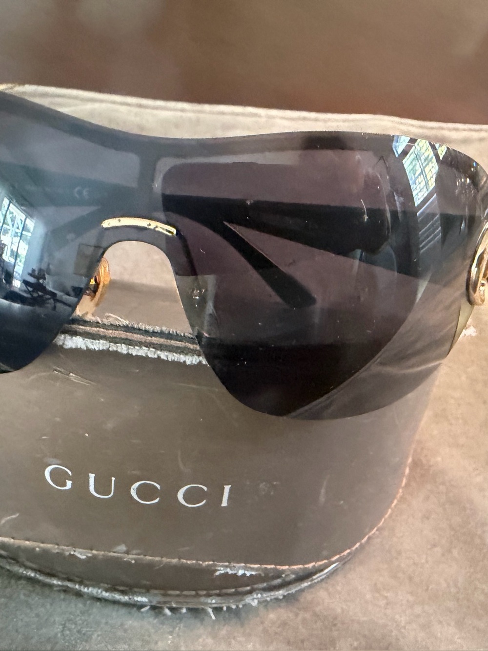 Gucci Women’s Black Shield Sunglasses with Gold Detail